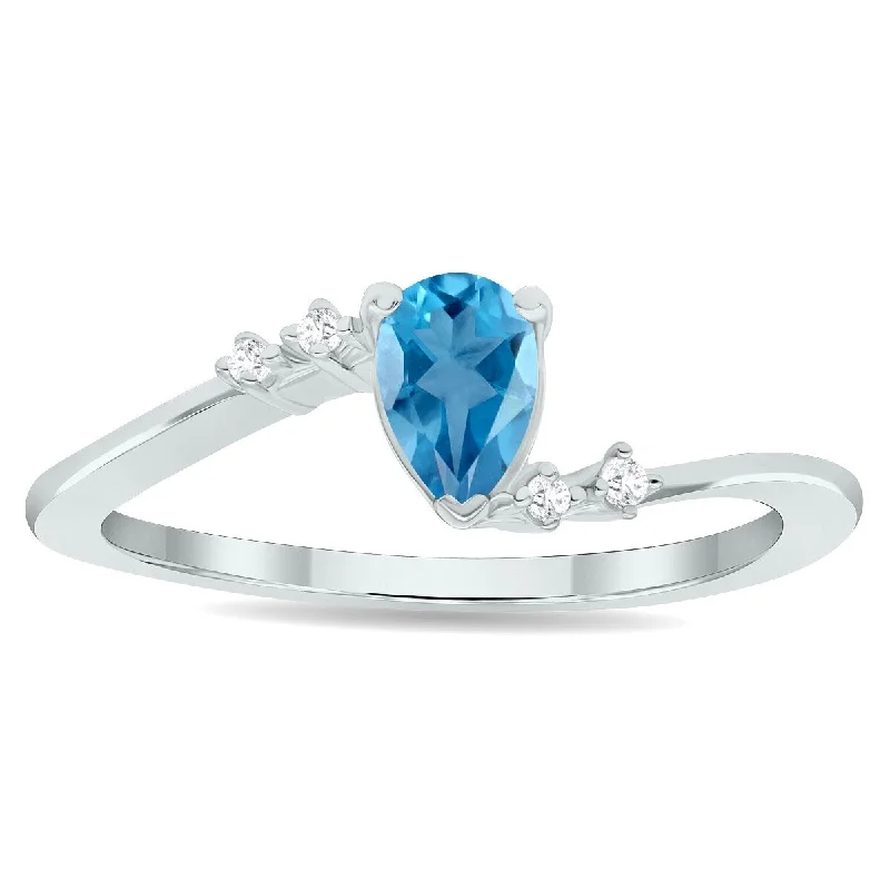 Women's Blue Topaz and Diamond Wave Ring in 10K White Gold